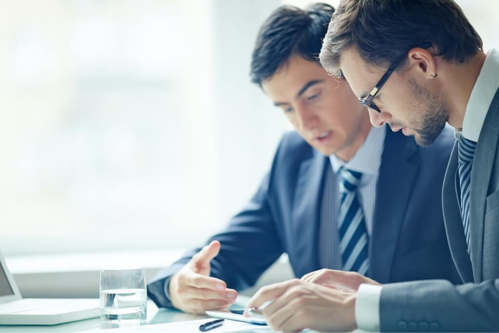 two business men discussing about accounting